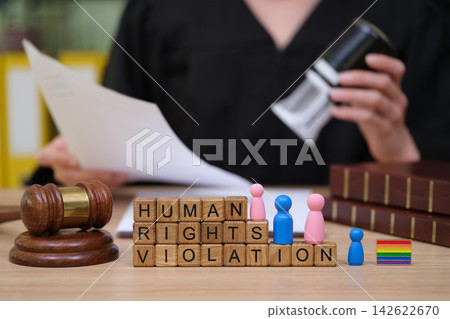 Courtroom scene shows a robed figure with a gavel and documents, alongside colorful figures discussing human rights violations Courtroom scene shows a robed figure with a gavel and documents, alongside colorful figures discussing human rights violations 142622670