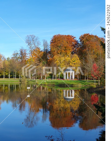 Phone photo of Orangerie Park in autumn colors. Scenic park scene showing fall foliage, walking paths, and tranquil urban greenery. Phone photo of Orangerie Park in autumn colors. Scenic park scene showing fall foliage, walking paths, and tranquil urban greenery. 142622932