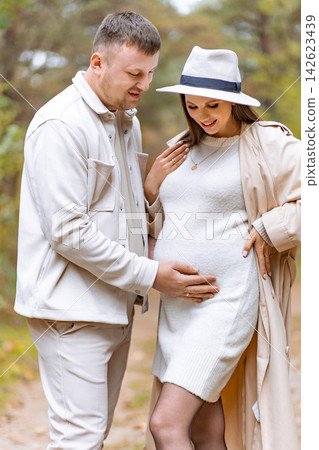 A loving couple anticipates the arrival of their baby while enjoying a beautiful day in nature A loving couple anticipates the arrival of their baby while enjoying a beautiful day in nature 142623439