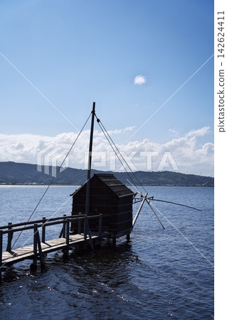 A characteristic sight of Lake Togo: four-pronged net fishing A characteristic sight of Lake Togo: four-pronged net fishing 142624411