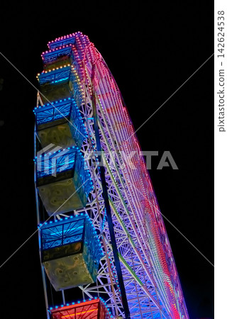 Stunning ferris wheel attraction glowing as part of Vigo s holiday celebration Stunning ferris wheel attraction glowing as part of Vigo s holiday celebration 142624538