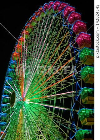 Stunning ferris wheel attraction glowing as part of Vigo s holiday celebration Stunning ferris wheel attraction glowing as part of Vigo s holiday celebration 142624545