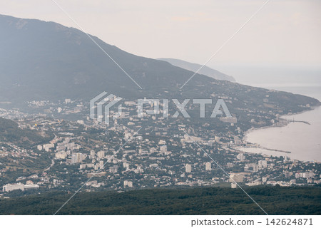 Yalta, Crimea, Bird's eye view panorama of city and Black Sea Yalta, Crimea, Bird's eye view panorama of city and Black Sea 142624871