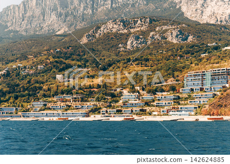 Yalta, Crimea, View cityscape panorama of city from Black Sea Yalta, Crimea, View cityscape panorama of city from Black Sea 142624885