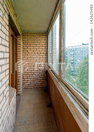 Interior of old covered balcony of residential building, loggia for renovation Interior of old covered balcony of residential building, loggia for renovation 142625493