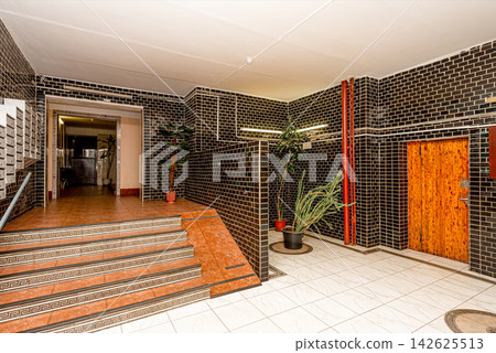Ground floor with mailboxes in residential building, front door entrance Ground floor with mailboxes in residential building, front door entrance 142625513