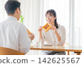 A couple who eats breakfast A couple who eats breakfast 142625567