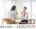 A couple who eats breakfast A couple who eats breakfast 142625570