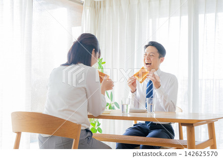 A couple who eats breakfast A couple who eats breakfast 142625570