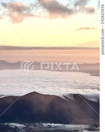 A sea of clouds and sunrise viewed from the summit of Mt. Fuji A sea of clouds and sunrise viewed from the summit of Mt. Fuji 142625656