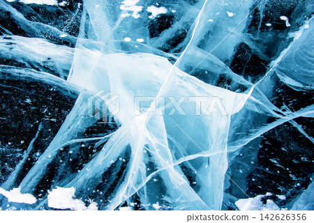 Deep blue ice texture lake Baikal water frozen winter, icy wallpaper background Deep blue ice texture lake Baikal water frozen winter, icy wallpaper background 142626356