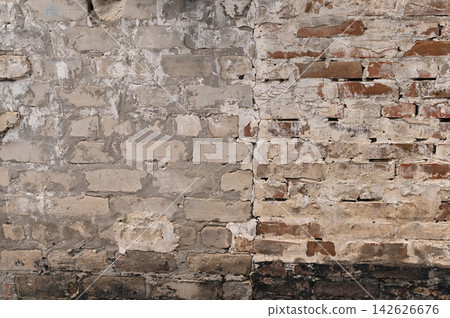 Brick wall with visible junction between different masonry styles and aged surfaces. Brick wall with visible junction between different masonry styles and aged surfaces. 142626676