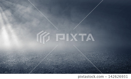 Dark empty asphalt ground at night with atmospheric fog, smoke, and a bright spotlight shining from the side, creating a dramatic, cinematic background. Smoke background Dark empty asphalt ground at night with atmospheric fog, smoke, and a bright spotlight shining from the side, creating a dramatic, cinematic background. Smoke background 142626931