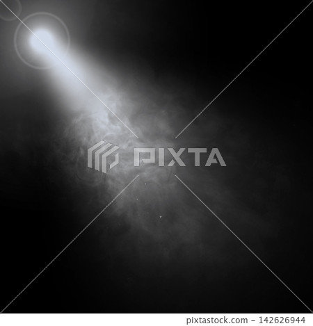 A bright spotlight shining from the top-left through smoke against a dark background, creating a dramatic stage lighting effect. Smoke background A bright spotlight shining from the top-left through smoke against a dark background, creating a dramatic stage lighting effect. Smoke background 142626944