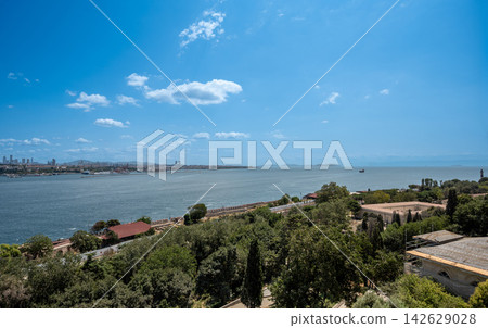 Istanbul,turkey,august 3, 2025. Istanbul bosphorus panoramic view of city skyline, coastline and calm blue water under sunny summer sky connecting europe and asia Istanbul,turkey,august 3, 2025. Istanbul bosphorus panoramic view of city skyline, coastline and calm blue water under sunny summer sky connecting europe and asia 142629028