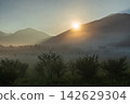 Sunrise and morning clouds shrouded in morning mist from Odashirogahara in Oku-Nikko in early autumn. 142629304