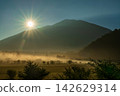 Sunrise and morning clouds shrouded in morning mist from Odashirogahara in Oku-Nikko in early autumn. 142629314