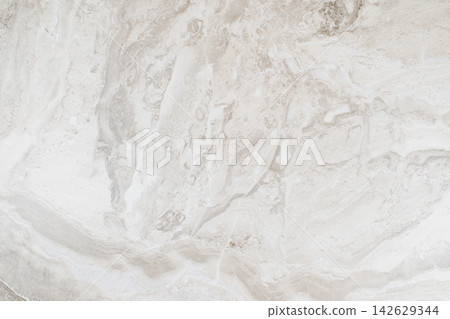 Smooth, light-colored marble texture with subtle veining patterns and a polished finish, ideal for backgrounds or design elements in various applications Smooth, light-colored marble texture with subtle veining patterns and a polished finish, ideal for backgrounds or design elements in various applications 142629344