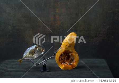 Still life with a sunfish and a cut pumpkin. Still life with a sunfish and a cut pumpkin. 142631855