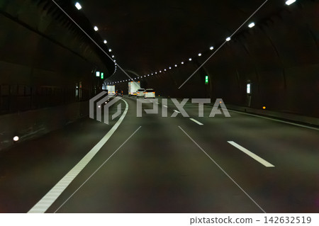 A view from the car window taken while driving through a highway tunnel. A view from the car window taken while driving through a highway tunnel. 142632519