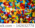 Top view A pile of multicolor of many Lego toy blocks in various shapes and different sizes. Toys and games. Leisure and recreation. 142632778