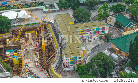 Hong Kong Aug 29 2026 colorful building beside construction site Hong Kong Aug 29 2026 colorful building beside construction site 142633285