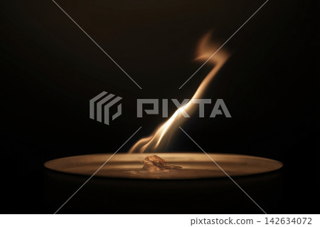 Flame bending under invisible airflow creating dynamic motion in dark setting Flame bending under invisible airflow creating dynamic motion in dark setting 142634072