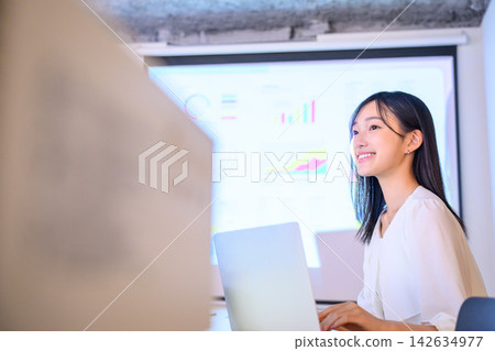 Women working on laptops Women working on laptops 142634977