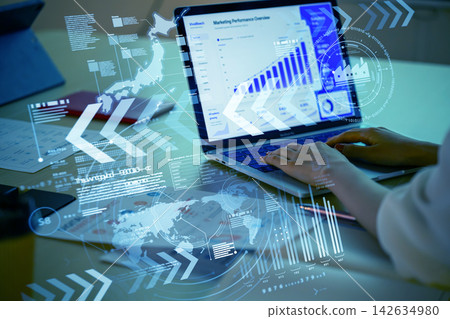 Analyzing marketing data on a laptop computer Analyzing marketing data on a laptop computer 142634980