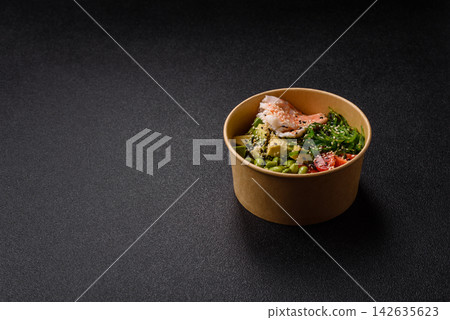 An Asian style bowl with shrimp, edamame, tomatoes, and wakame. A shrimp and vegetable bowl An Asian style bowl with shrimp, edamame, tomatoes, and wakame. A shrimp and vegetable bowl 142635623