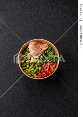 An Asian style bowl with shrimp, edamame, tomatoes, and wakame. A shrimp and vegetable bowl An Asian style bowl with shrimp, edamame, tomatoes, and wakame. A shrimp and vegetable bowl 142635624