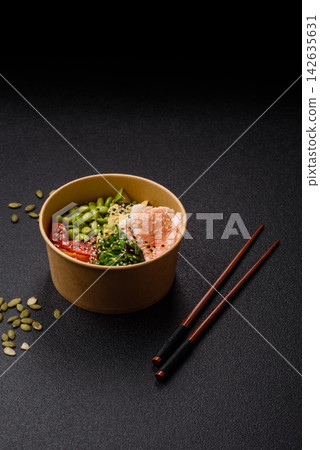 An Asian style bowl with shrimp, edamame, tomatoes, and wakame. A shrimp and vegetable bowl An Asian style bowl with shrimp, edamame, tomatoes, and wakame. A shrimp and vegetable bowl 142635631