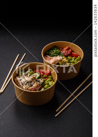 An Asian style bowl with shrimp, edamame, tomatoes, and wakame. A shrimp and vegetable bowl An Asian style bowl with shrimp, edamame, tomatoes, and wakame. A shrimp and vegetable bowl 142635634