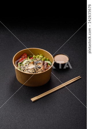 An Asian style bowl with eel, edamame, avocado, tomatoes, and lettuce. A eel and vegetable bowl An Asian style bowl with eel, edamame, avocado, tomatoes, and lettuce. A eel and vegetable bowl 142635676