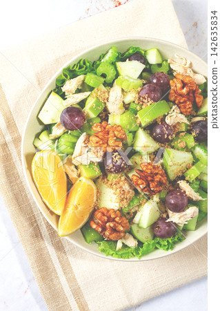 Fresh Waldorf salad, celery stalk with chicken, apple and walnuts, grapes, herbs, homemade, without people, Fresh Waldorf salad, celery stalk with chicken, apple and walnuts, grapes, herbs, homemade, without people, 142635834