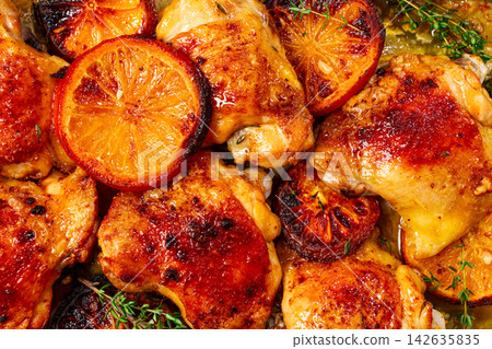 Grilled chicken thighs, baked with orange slices and thyme, on a baking sheet, homemade, no people, Grilled chicken thighs, baked with orange slices and thyme, on a baking sheet, homemade, no people, 142635835
