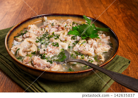 Muzhuzhi, a Georgian dish made from pork legs, with spices and herbs, homemade Muzhuzhi, a Georgian dish made from pork legs, with spices and herbs, homemade 142635837