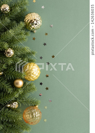 Festive Christmas Tree Branches With Golden Ornaments And Star Confetti On A Soft Green Background With Copy Space Festive Christmas Tree Branches With Golden Ornaments And Star Confetti On A Soft Green Background With Copy Space 142636035