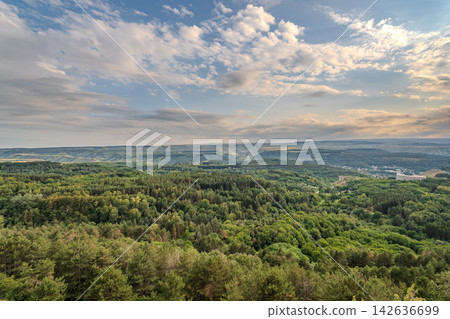 Layers of green mountains and hills in the haze during sunset. Panoramic View of Green hills and Meadow. Layers of green mountains and hills in the haze during sunset. Panoramic View of Green hills and Meadow. 142636699