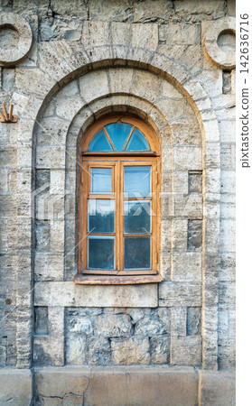 The window of the old mansion 19 century with brown bricks wall The window of the old mansion 19 century with brown bricks wall 142636716