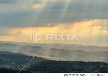 Layers of green mountains and hills in the haze during sunset. Panoramic View of Green hills and Meadow. Layers of green mountains and hills in the haze during sunset. Panoramic View of Green hills and Meadow. 142636775