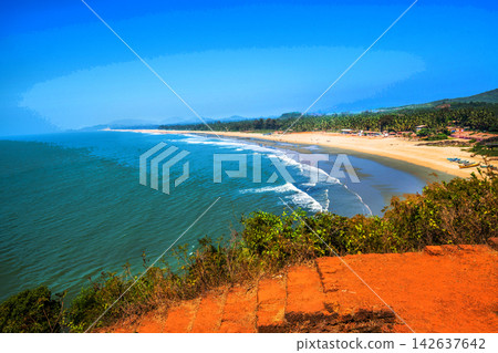 Awe view on beach with tourists and locals in town (village) fishing village in Goa (or Kerala ot Karnataka). Awe view on beach with tourists and locals in town (village) fishing village in Goa (or Kerala ot Karnataka). 142637642