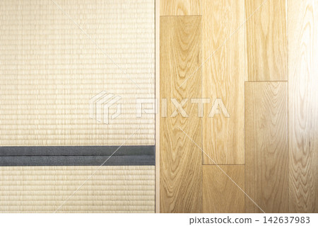 A photo of the floor inside the building. Half is hardwood flooring, and the other half is tatami mats. A photo of the floor inside the building. Half is hardwood flooring, and the other half is tatami mats. 142637983