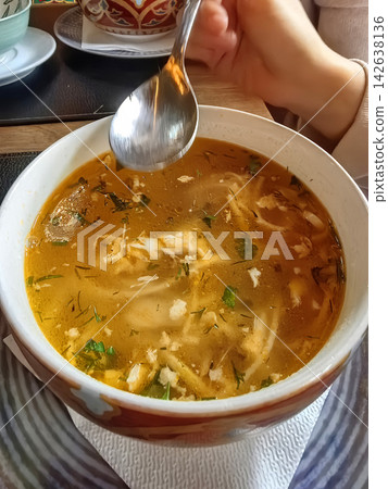 Delicious ugra osh with homemade noodles, carrots, and chicken breast Delicious ugra osh with homemade noodles, carrots, and chicken breast 142638136