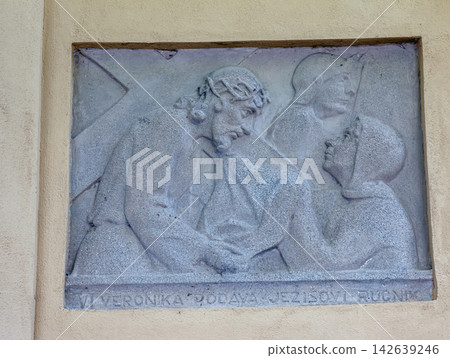 Nitra, Slovakia - May 27, 2024: VI Station Relief Showing Veronica Offering Her Veil to Jesus Nitra, Slovakia - May 27, 2024: VI Station Relief Showing Veronica Offering Her Veil to Jesus 142639246