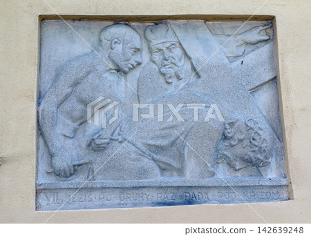 Nitra, Slovakia - May 27, 2024: VII Station Relief Showing Jesus Falling for the Second Time Nitra, Slovakia - May 27, 2024: VII Station Relief Showing Jesus Falling for the Second Time 142639248