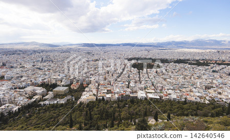 Athens, Attica, Greece, beautiful panoramic view of Athens cityscape, with The Parthenon, mountains, sea and scenery beyond the city, seen from Mount Lycabettus Hill observation deck in a sunny day Athens, Attica, Greece, beautiful panoramic view of Athens cityscape, with The Parthenon, mountains, sea and scenery beyond the city, seen from Mount Lycabettus Hill observation deck in a sunny day 142640546