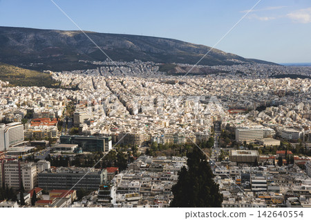 Athens, Attica, Greece, beautiful panoramic view of Athens cityscape, with The Parthenon, mountains, sea and scenery beyond the city, seen from Mount Lycabettus Hill observation deck in a sunny day 142640554
