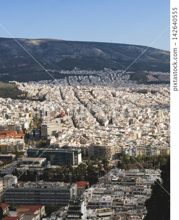 Athens, Attica, Greece, beautiful panoramic view of Athens cityscape, with The Parthenon, mountains, sea and scenery beyond the city, seen from Mount Lycabettus Hill observation deck in a sunny day Athens, Attica, Greece, beautiful panoramic view of Athens cityscape, with The Parthenon, mountains, sea and scenery beyond the city, seen from Mount Lycabettus Hill observation deck in a sunny day 142640555
