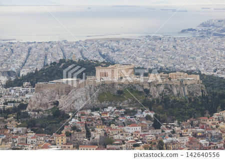 Athens, Attica, Greece, beautiful panoramic view of Athens cityscape, with The Parthenon, mountains, sea and scenery beyond the city, seen from Mount Lycabettus Hill observation deck in a sunny day Athens, Attica, Greece, beautiful panoramic view of Athens cityscape, with The Parthenon, mountains, sea and scenery beyond the city, seen from Mount Lycabettus Hill observation deck in a sunny day 142640556